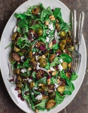 Mediterranean roasted brussels sprouts salad on large serving platter