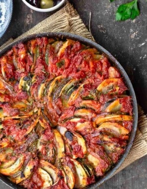 Briam Greek Roasted Vegetables with a side of olives and fresh parsley