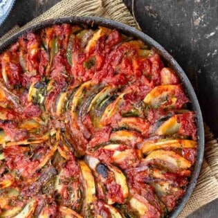 Briam Greek Roasted Vegetables with a side of olives and fresh parsley