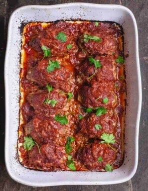 Greek Baked Meatballs with Red Sauce. Garnished with Parsley