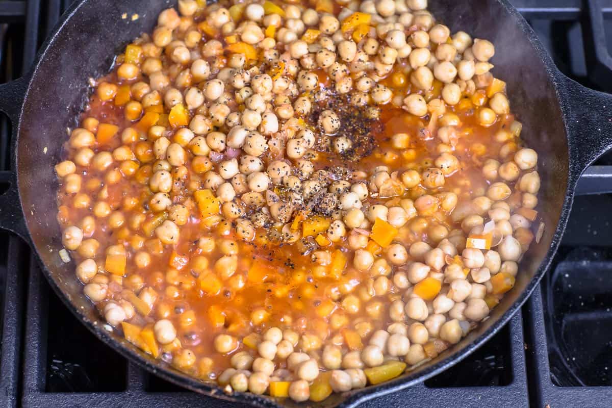 Chickpeas cooking in red sauce