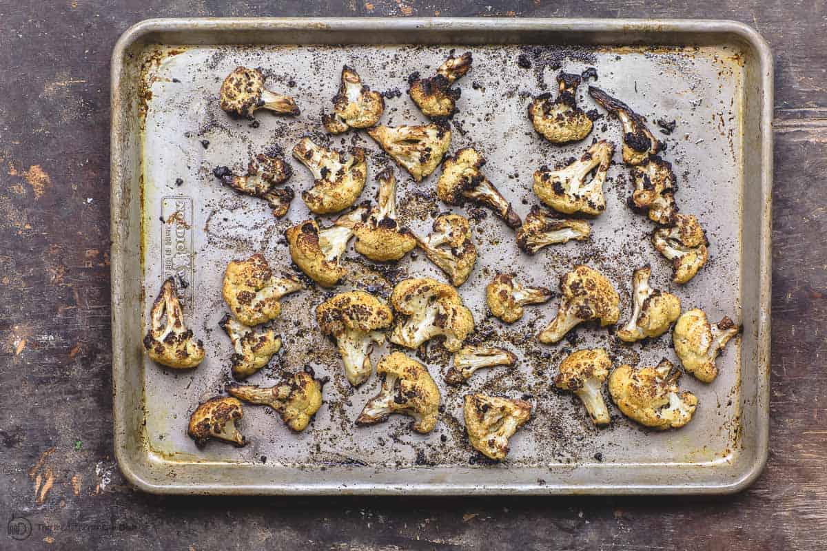 Fully roasted cauliflower on baking sheet