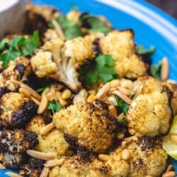 Roasted cauliflower with cumin and lemon, served with a side of tahini