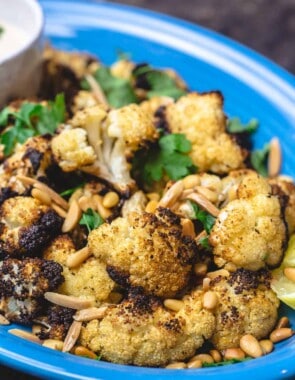 Roasted cauliflower with cumin and lemon, served with a side of tahini