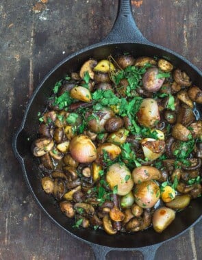 Shallot Garlic Mushroom recipe. Served in large cast iron skillet with parsley garnish.