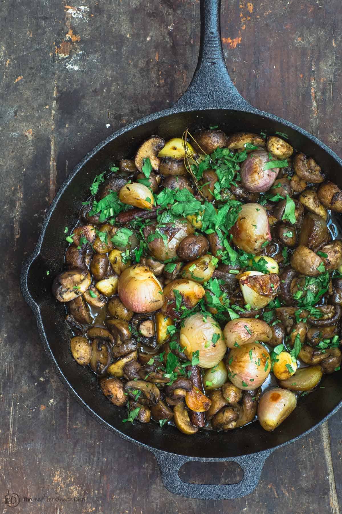 Shallot Garlic Mushroom recipe. Served in large cast iron skillet with parsley garnish. 