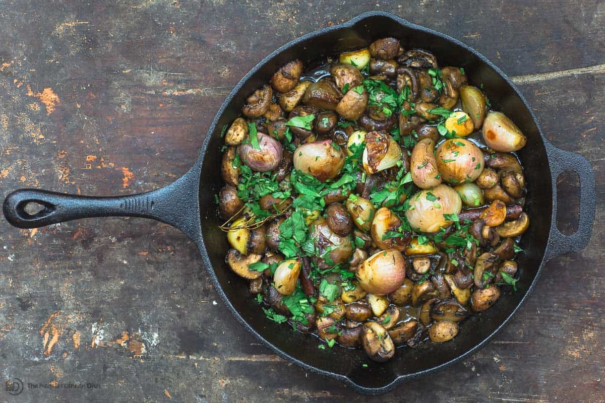 Shallot garlic mushrooms in skillet, garnished with parsley