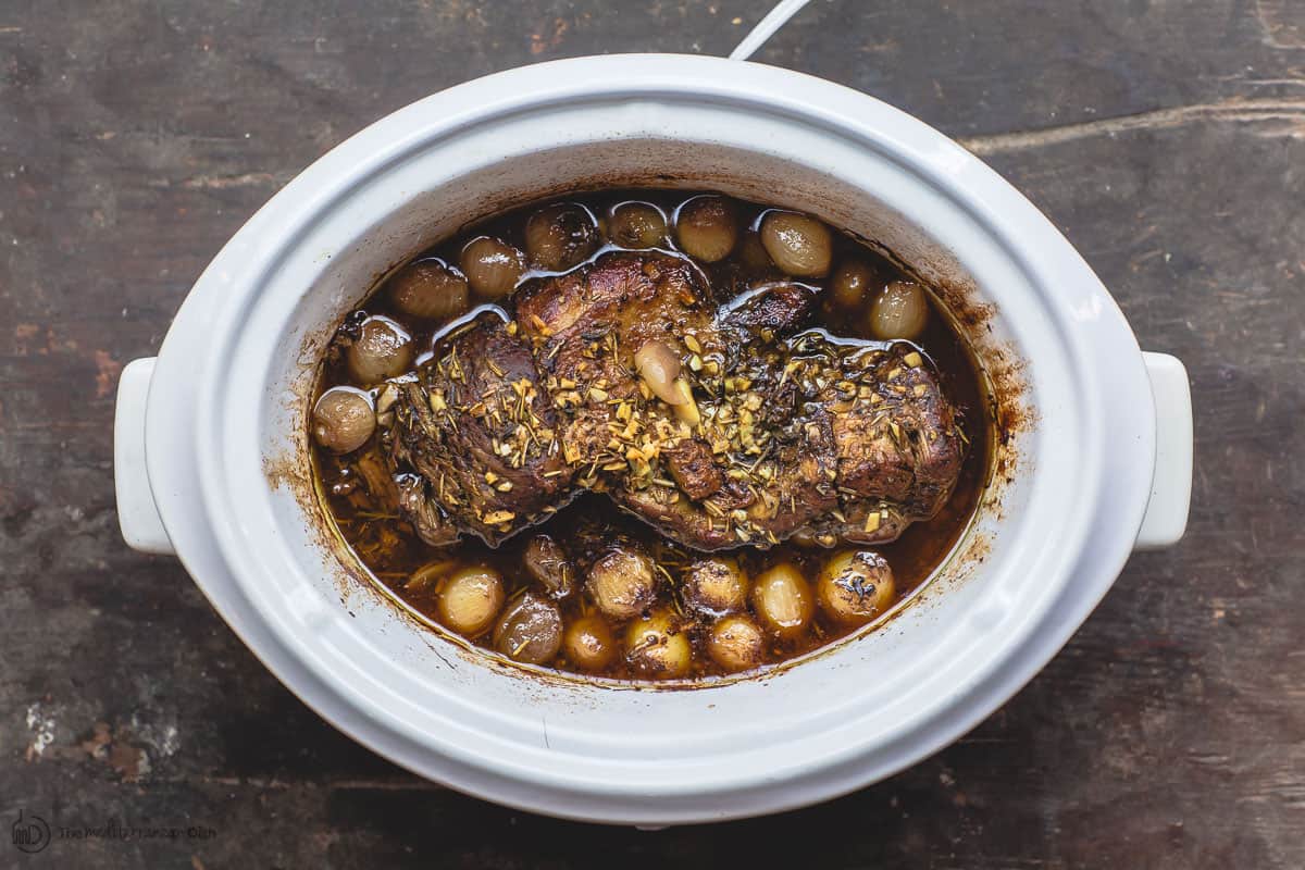 Slow Cooker with Boneless Leg of Lamb, Pearl Onions and Wine Broth
