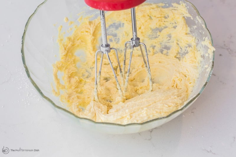 Ghee being whipped using a hand-held electric mixer