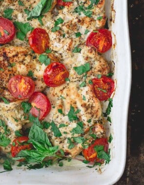 Italian Baked Chicken with Tomatoes. Garnished with Basil and Parsley