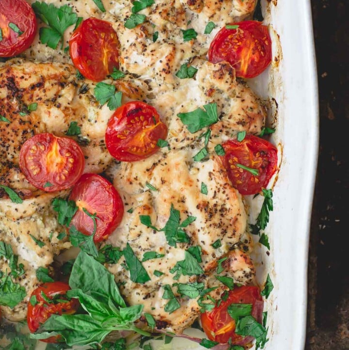 Italian Baked Chicken with Tomatoes. Garnished with Basil and Parsley