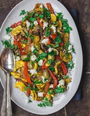 Sauteed Yellow Squash with Sweet Onions and bell peppers. Served with a garnish of feta cheese, olives and parsley