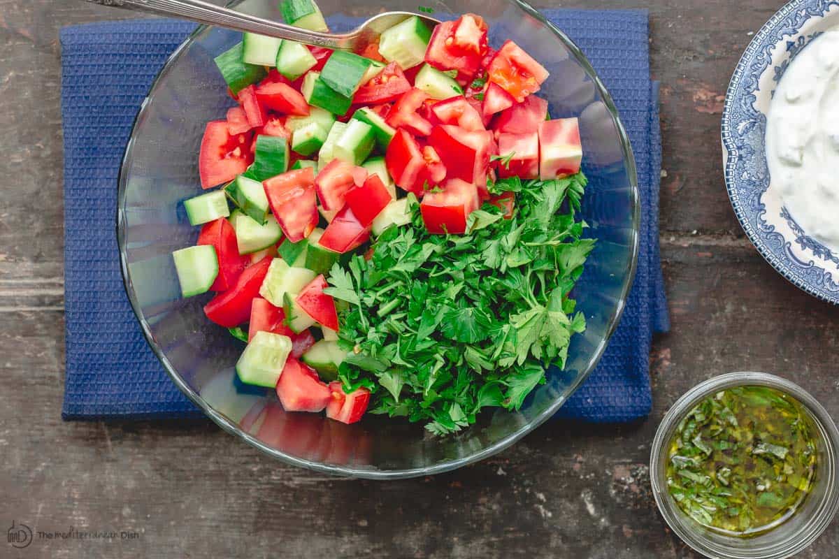 Mediterranean salad, lemon basil sauce, and Tzatziki sauce 