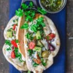 Grilled cod gyros with a side of lemon basil sauce