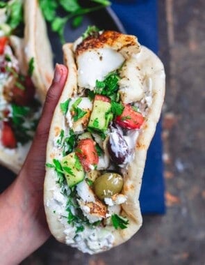 Grilled cod assembled gyro-style in pita wraps