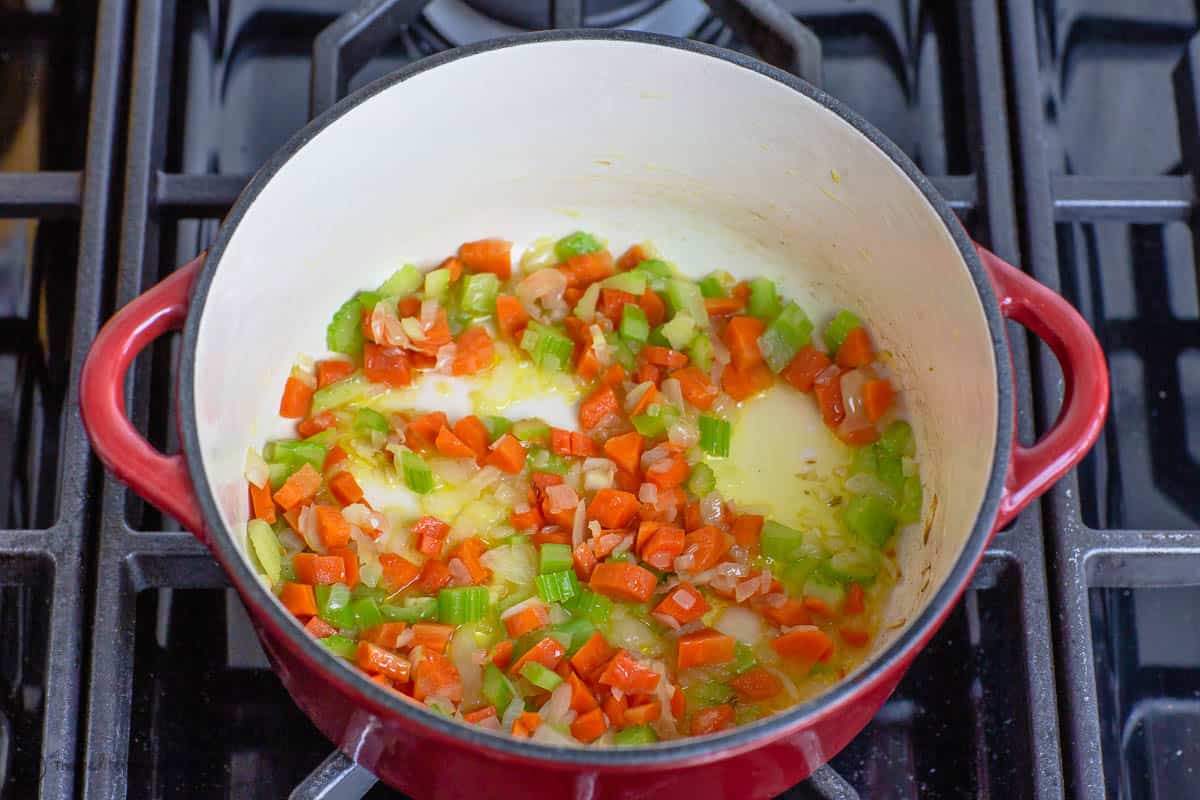 Onions, celery and carrots sauteing in olive oil