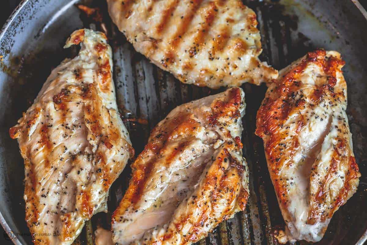 Chicken breasts grilled in skillet