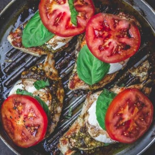 Easy Caprese Chicken with basil pesto, fresh mozzarella, ripe tomatoes, and balsamic glaze