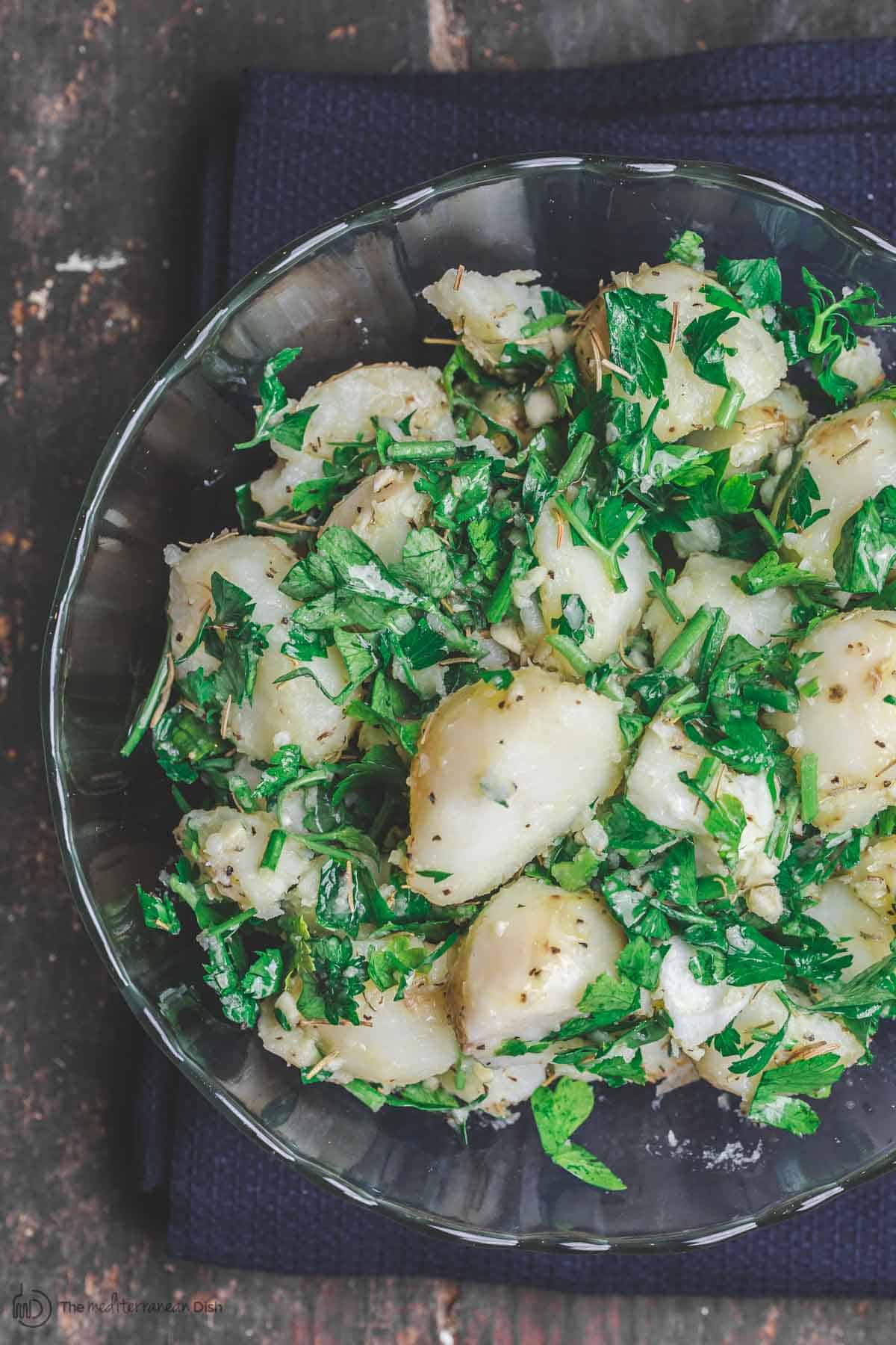 Simple boiled potatoes, tossed with garlic, fresh herbs and extra virgin olive oil