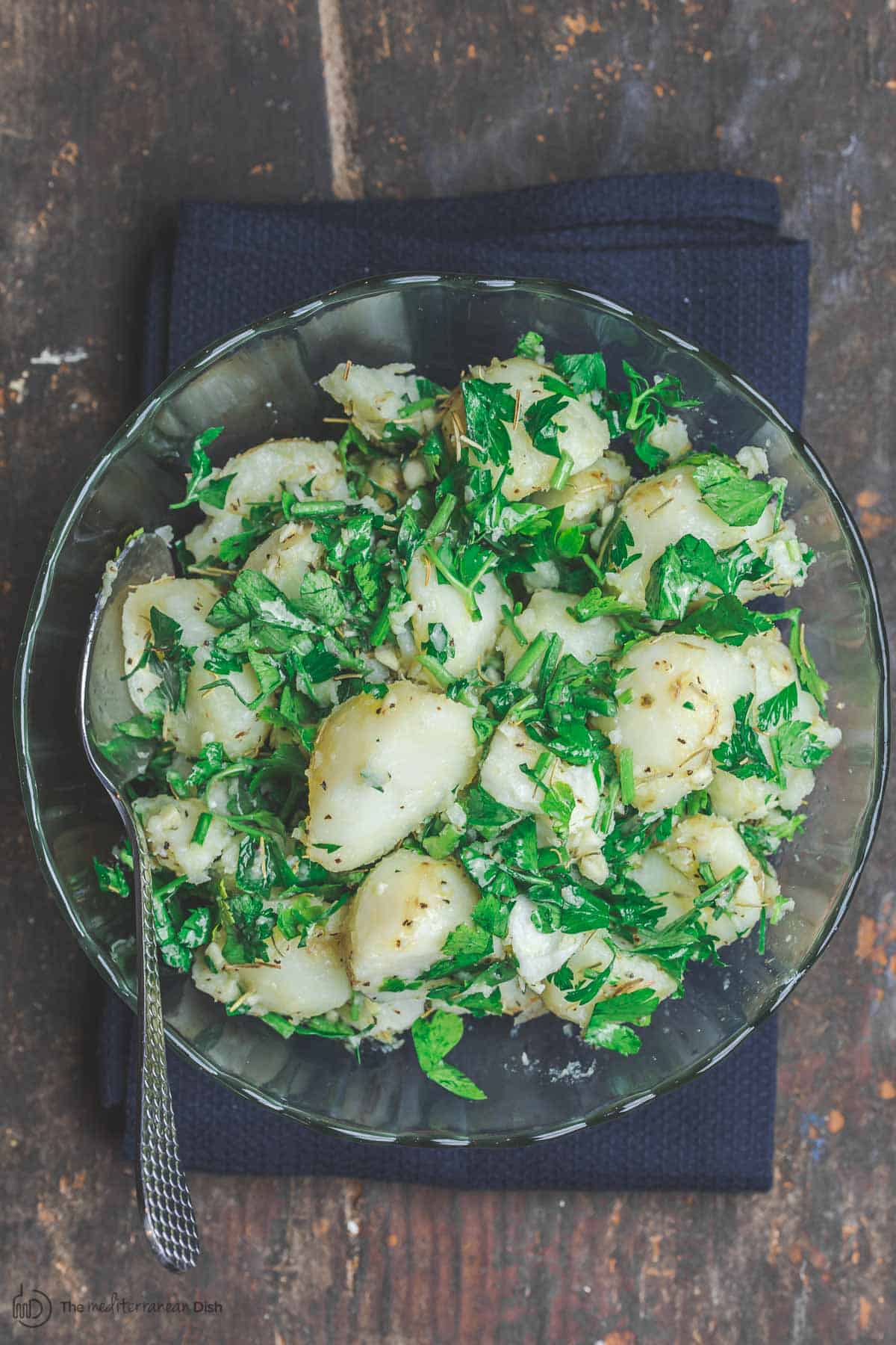 boiled potatoes tossed with garlic, fresh herbs and extra virgin olive oil