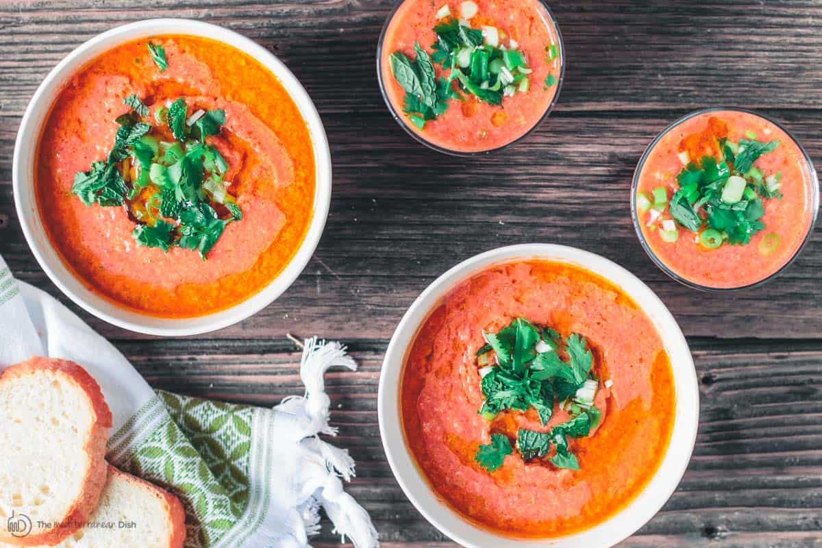 Gazpacho soup served in bowls and small glasses