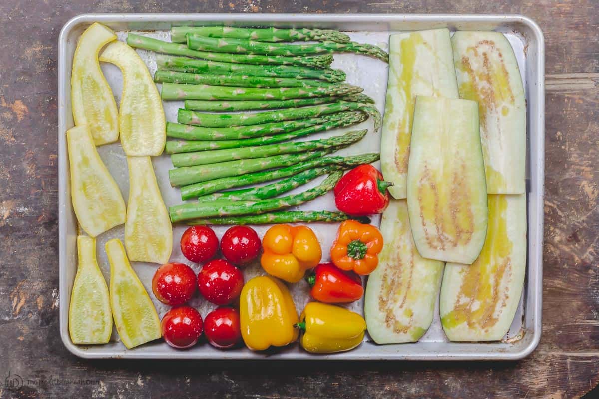 Raw vegetables prepared for grilling. Drizzled with extra virgin olive oil.