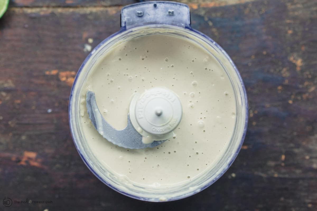 Tahini sauce full blended into a salad dressing like consistency