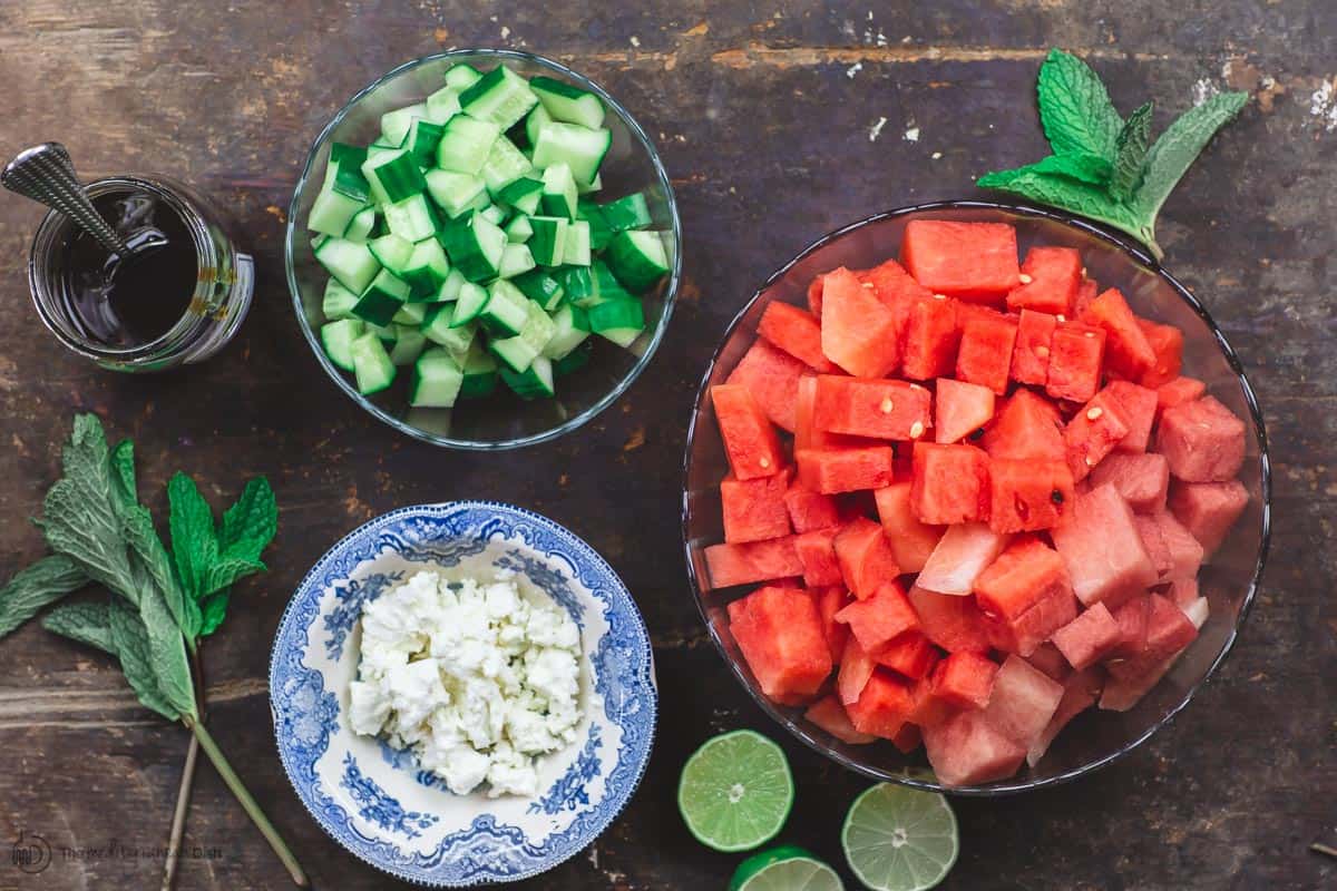 Ingredients for Mediterranean Watermelon Salad. Cubed watermelon, cucumber, fresh herbs, honey, lime