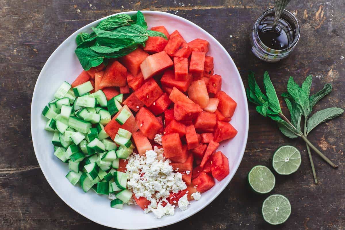 Watermelon, Cucumber, Feta, and Fresh Herbs in one large bowl