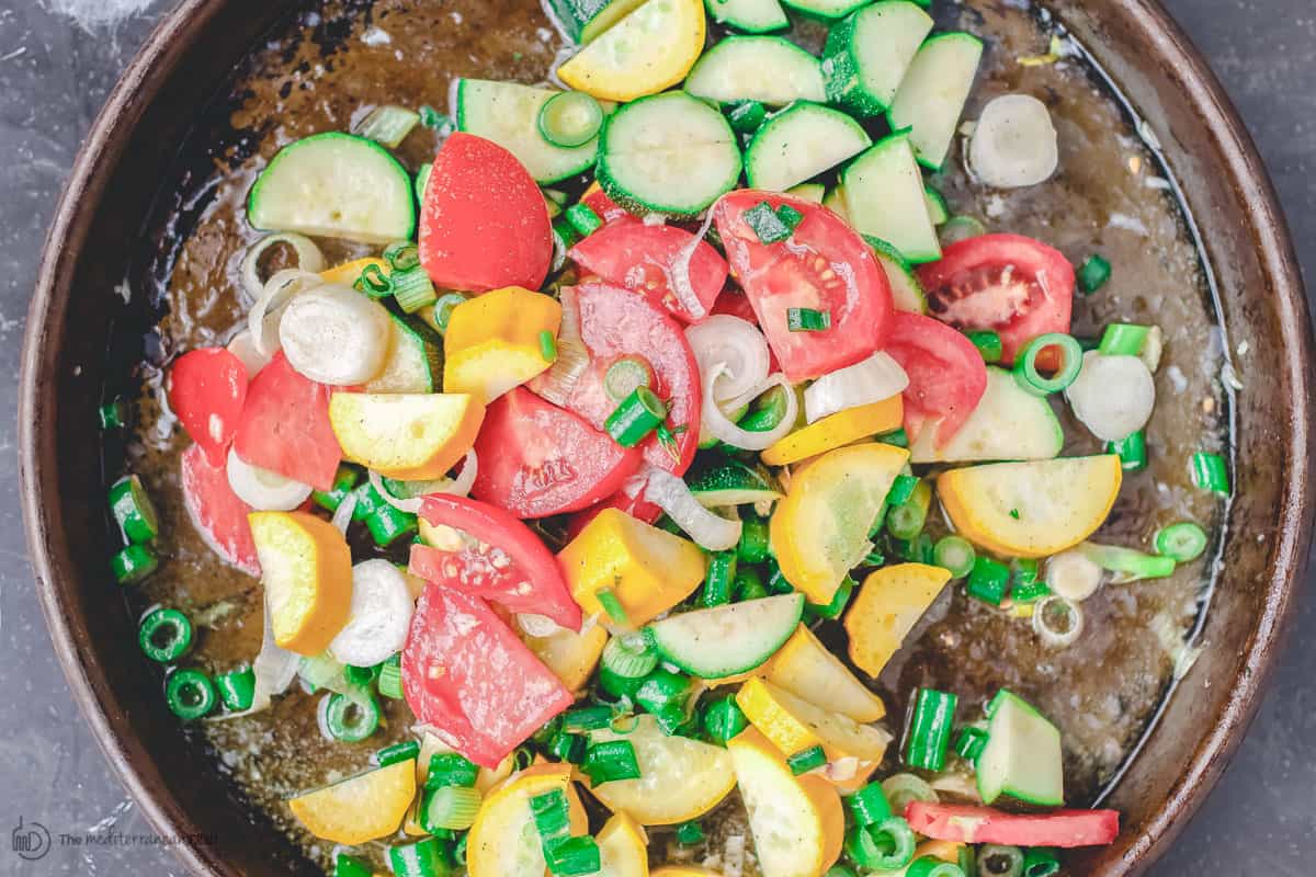 Sliced vegetables in a baking pan