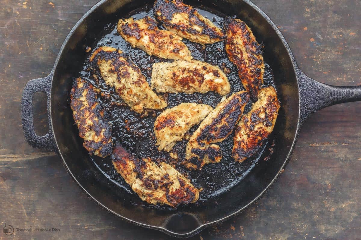 Chicken tenders cooked in a cast iron pan