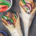 Chicken gyro wraps with tzatziki sauce, tomatoes and olives