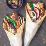 Chicken gyros wraps served with black and green olives