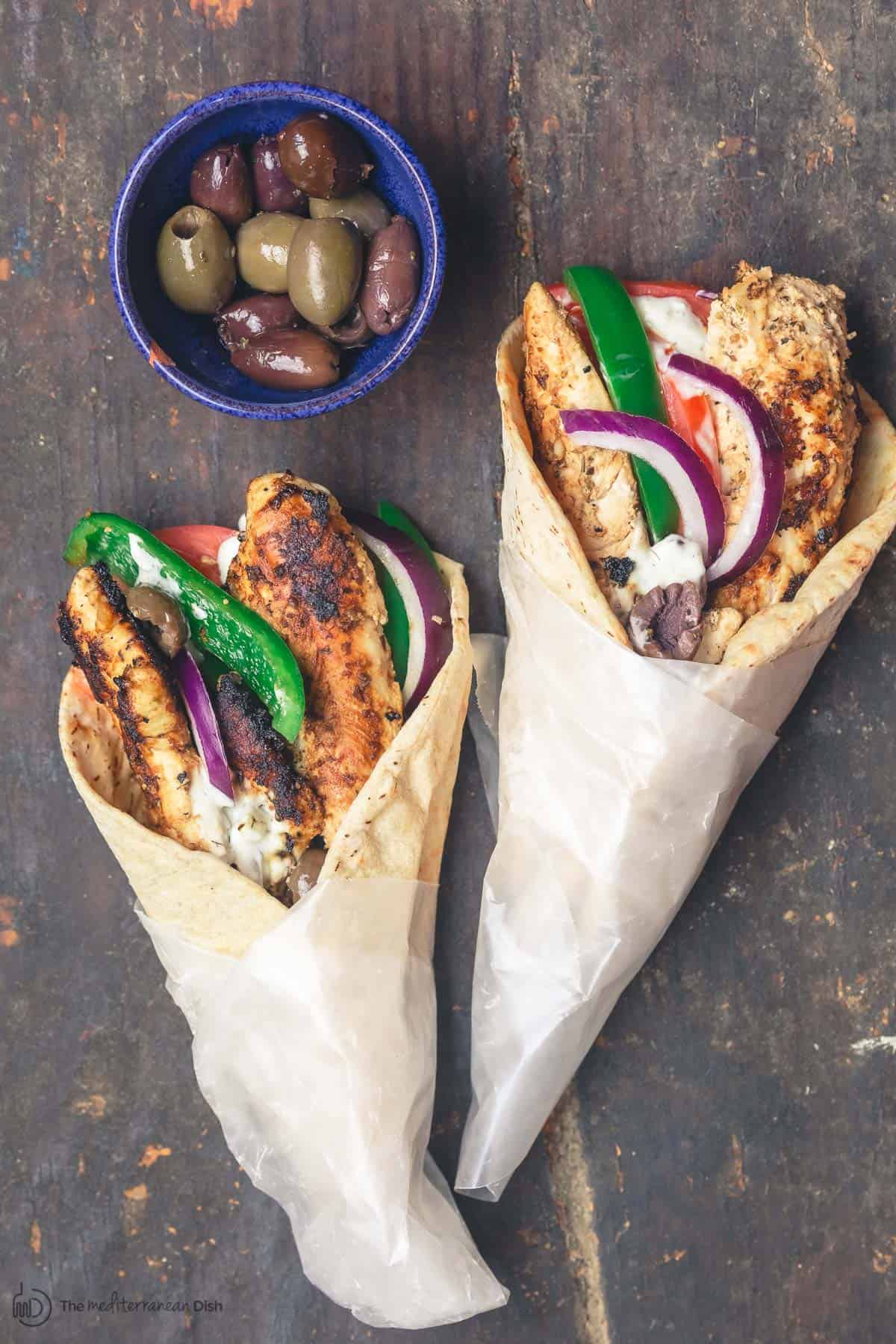 Chicken gyros wraps served with black and green olives