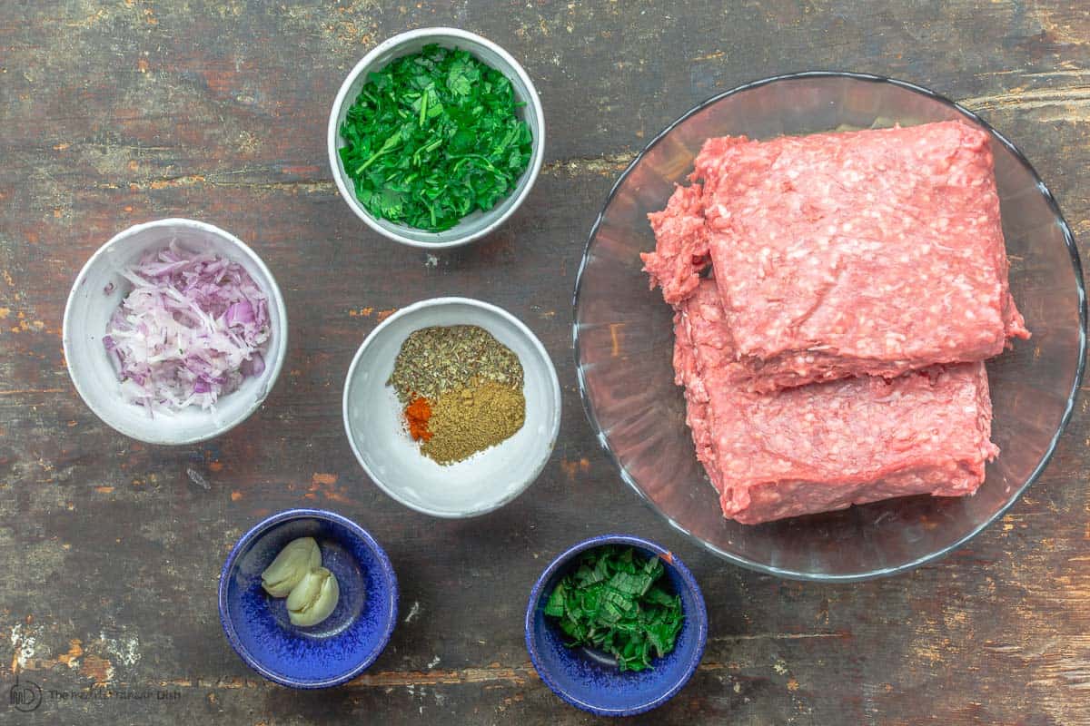 Ingredients for lamb burger arranged on a table