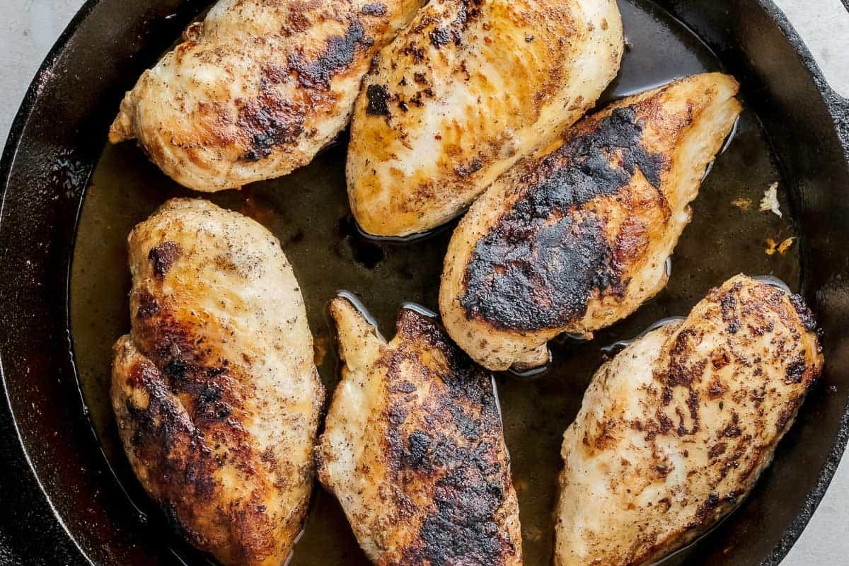 Blackened chicken breast in a fyring pan