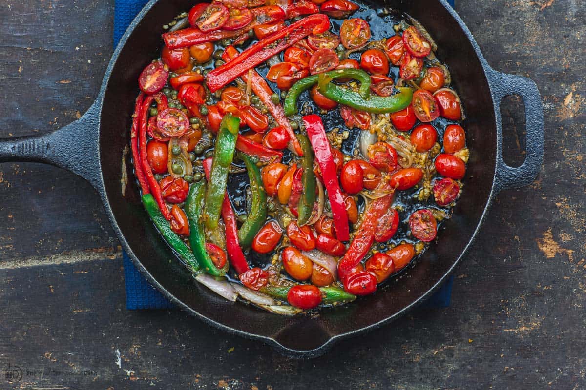 Tomatoes and bell peppers sauteed in skillet