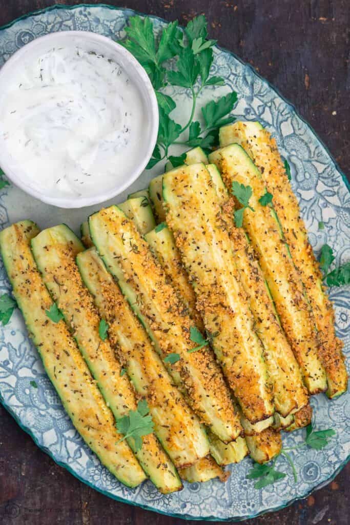 Baked Zucchini Sticks On plate with garnish of fresh parsley