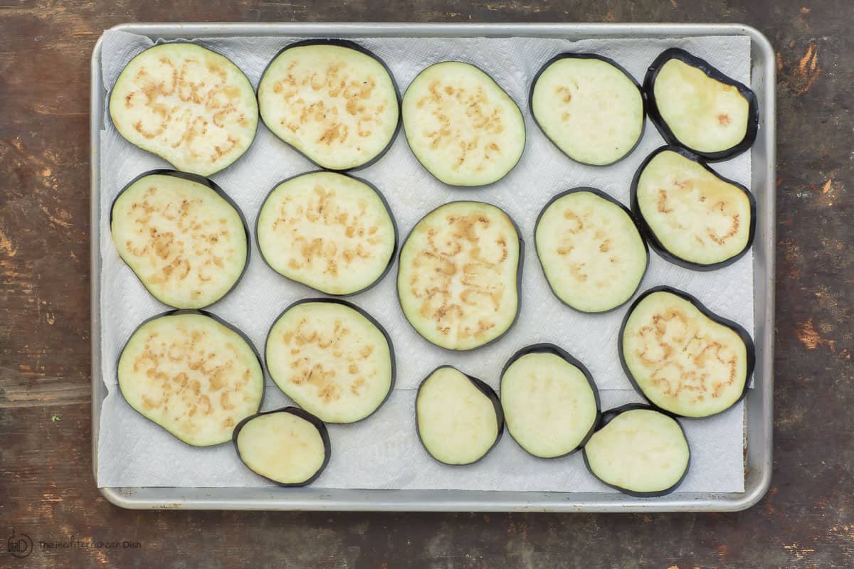 Eggplant slices on a baking sheet