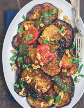 Slices of fried eggplant and vegetables served on a plate