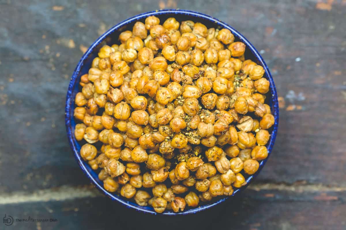 Crunchy roasted chickpeas served in blue bowl