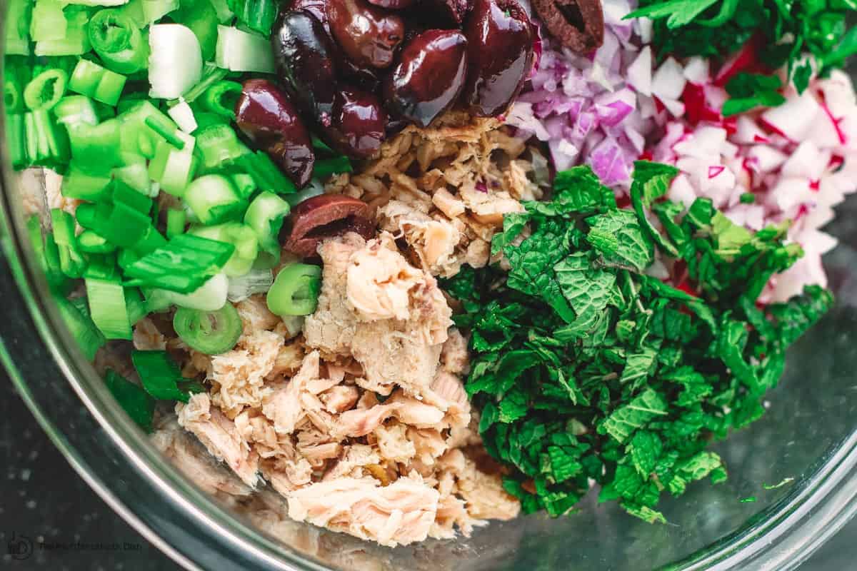 Tuna salad ingredients in a mixing bowl