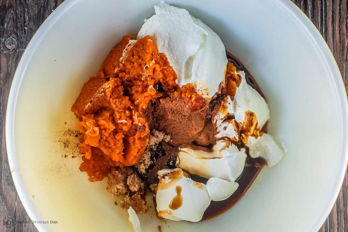 Pumpkin parfait ingredients in a large mixing bowl