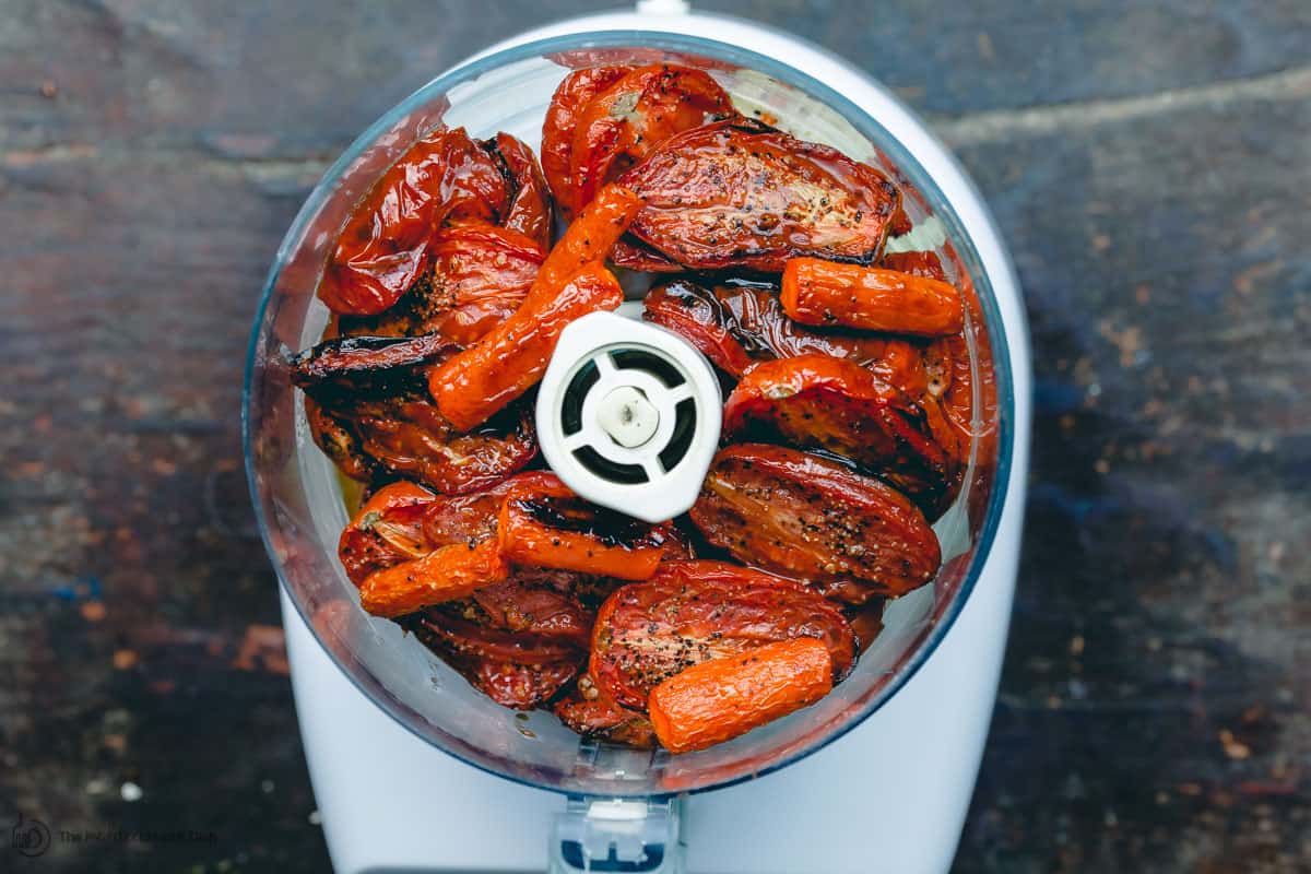 Roasted tomatoes and carrots added to food processor