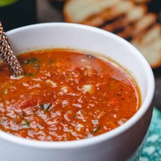 Roasted Tomato Basil Soup served in cups with grilled bread slices