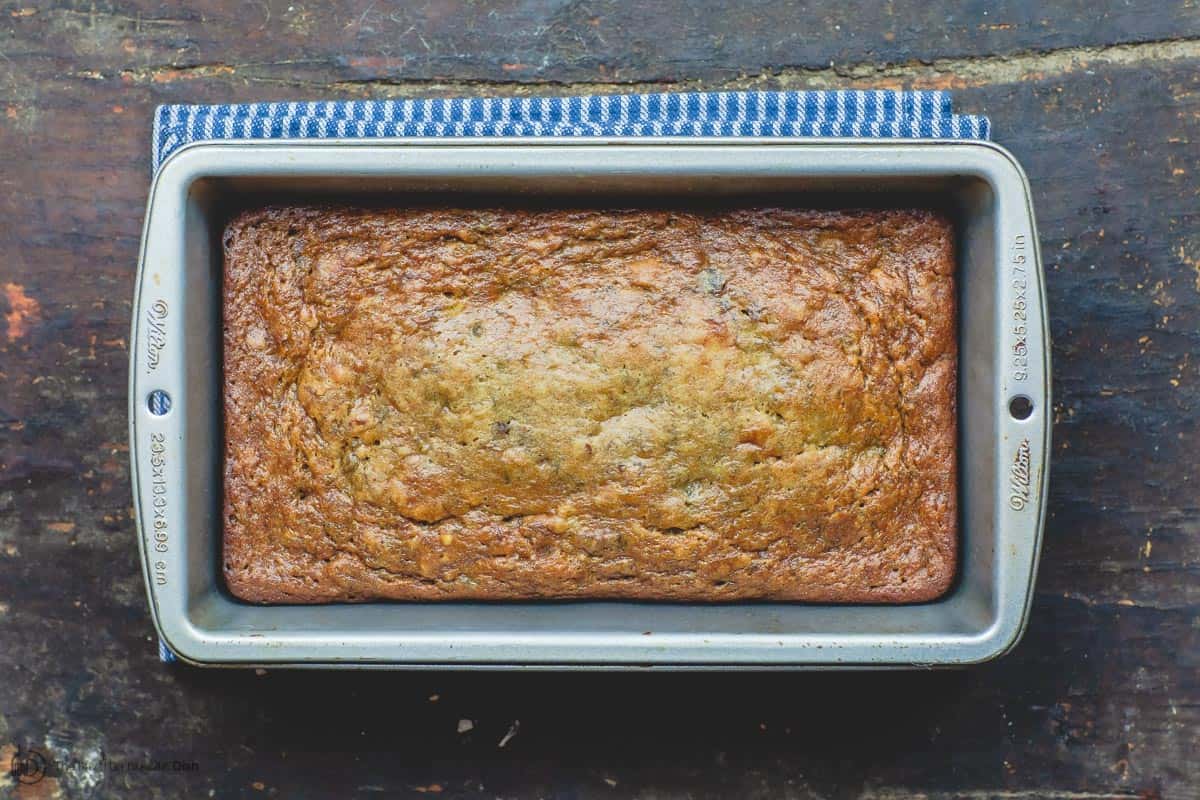 Loaf of banana walnut bread in baking pan