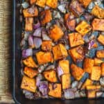 Diced sweet potatoes and onions roasted in cast iron pan