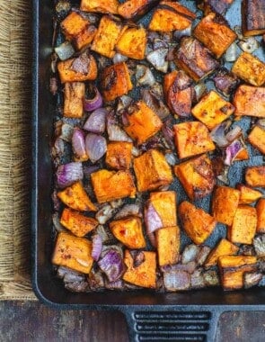 Diced sweet potatoes and onions roasted in cast iron pan