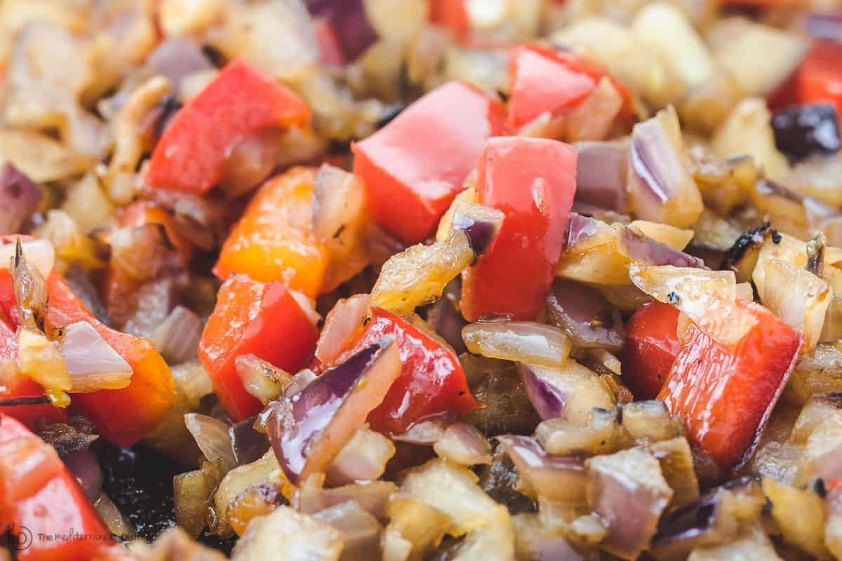 Sauteed red onions and diced red bell peppers