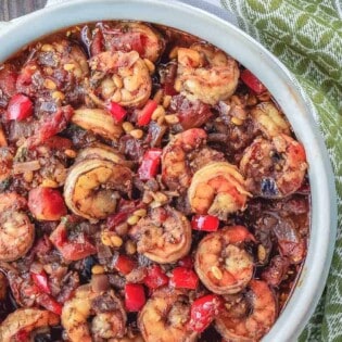 Shrimp stew served in bowl on a table setting